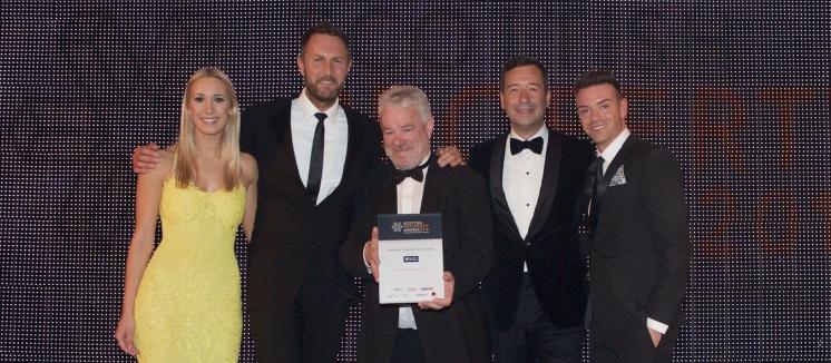 Artisan picking up their prize at the Scottish Property Award for Property Company of the Year 